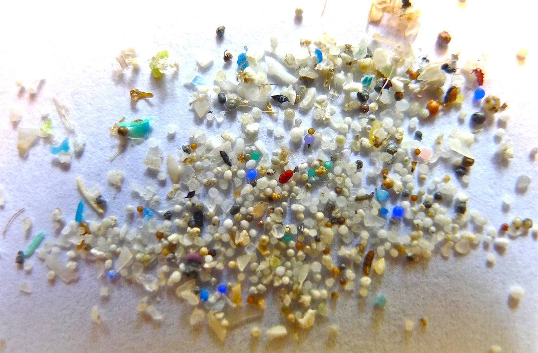 Close-up of colorful microplastic particles and pellets