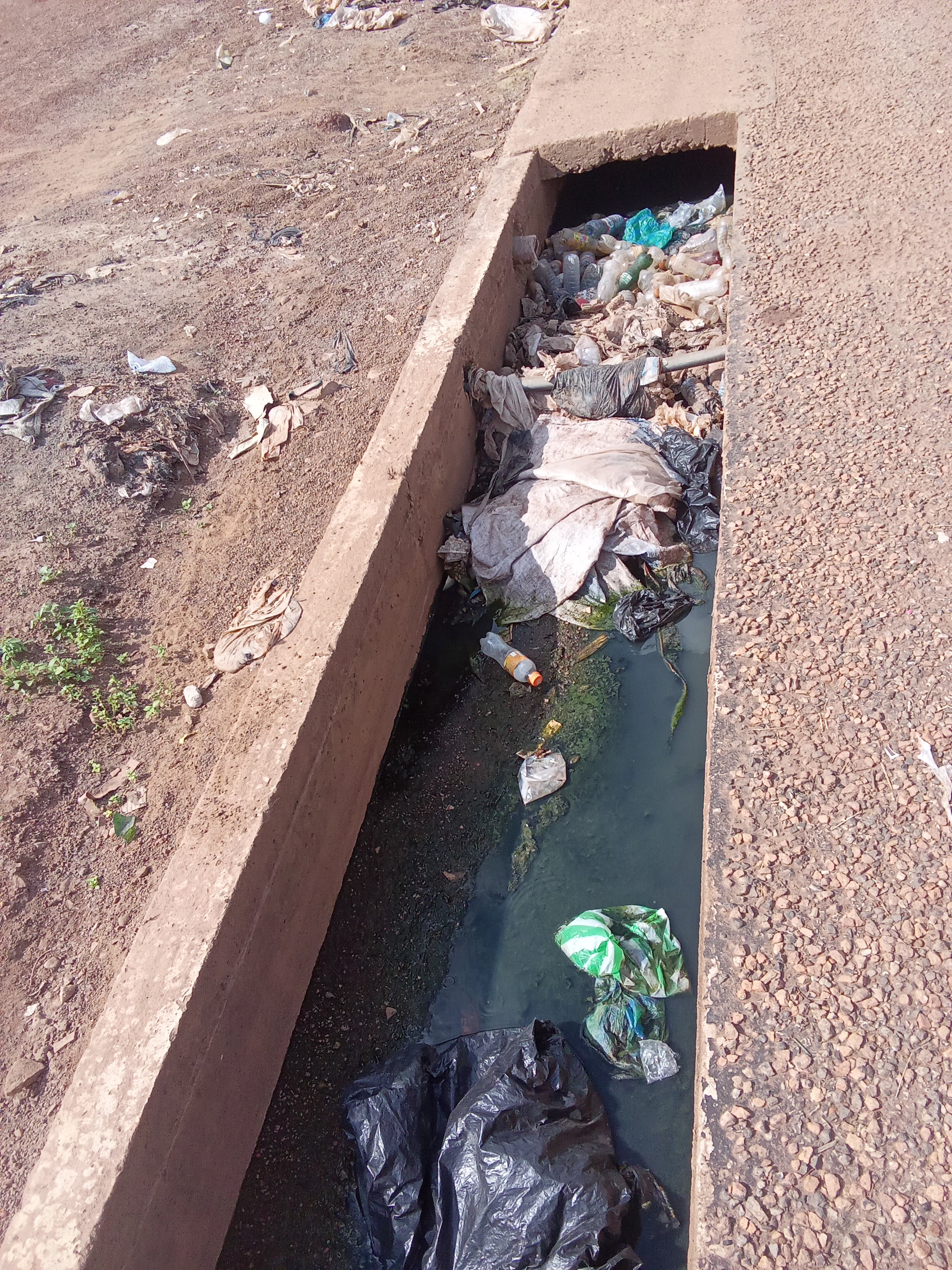 Plastic waste and pollution clogging a waterway